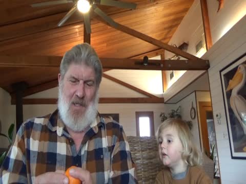 Sharing a Orange and a Goo Goo Cluster with the Grandson... Thumbnail